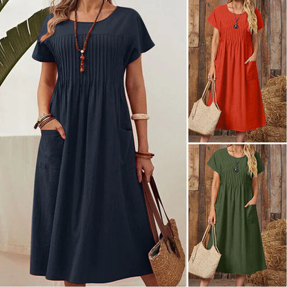Irene - Vestido plisado con mangas cortas y bolsillos