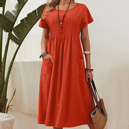 Irene - Vestido plisado con mangas cortas y bolsillos